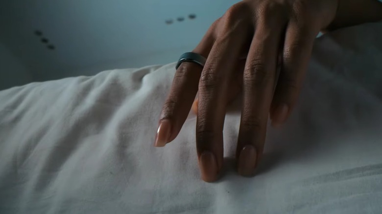 Close up of a hand wearing a smart ring.