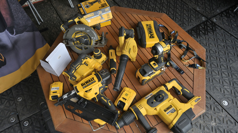 DeWalt power tools placed around a table
