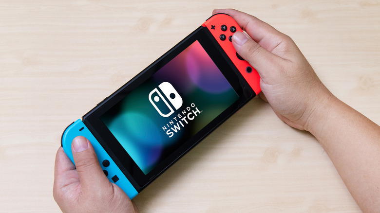 Someone holding Nintendo Switch