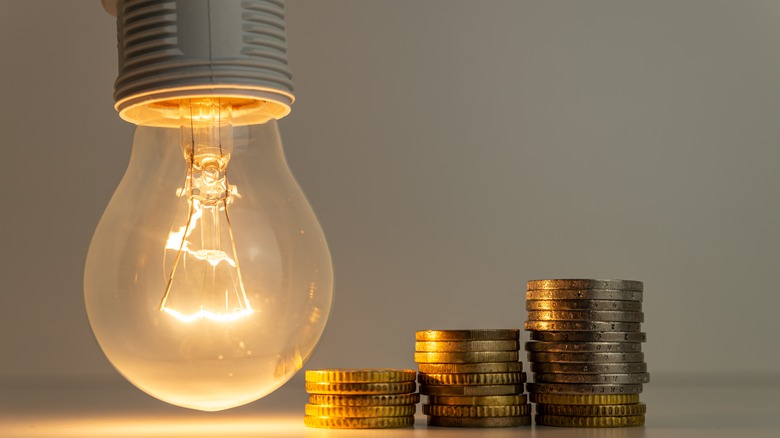 coins next to light bulb