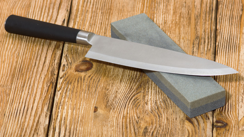 Knife resting on whetstone