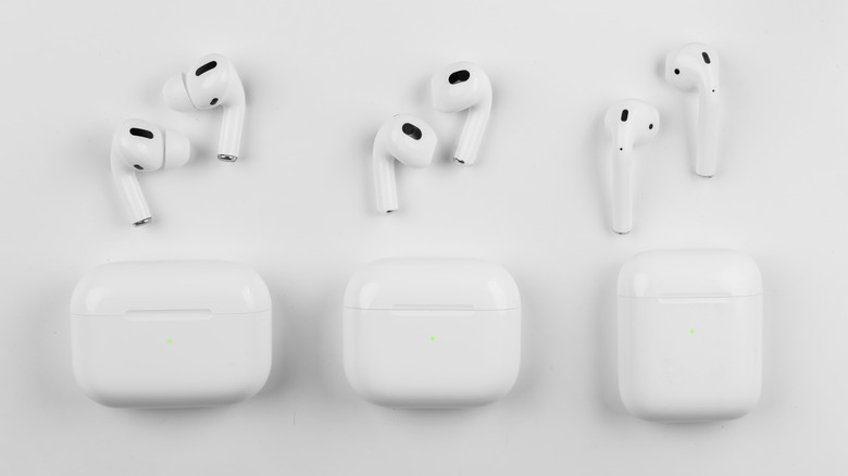 Three generations of an AirPods on a table