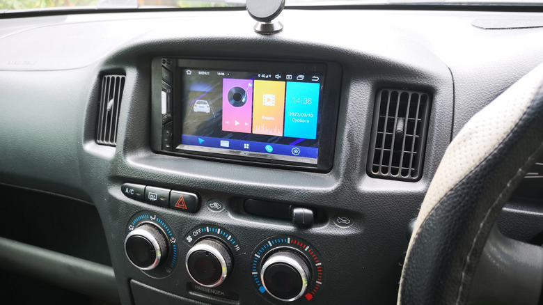 A car stereo with an integrated touch screen.
