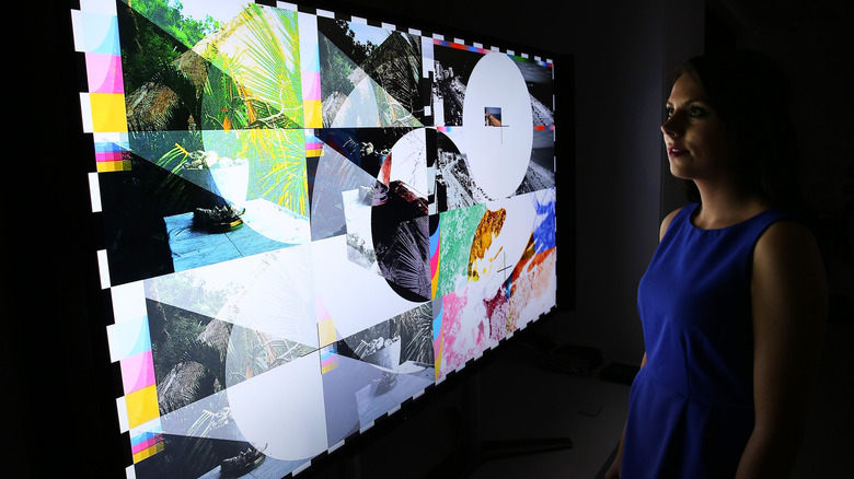 woman looking at Samsung OLED TV