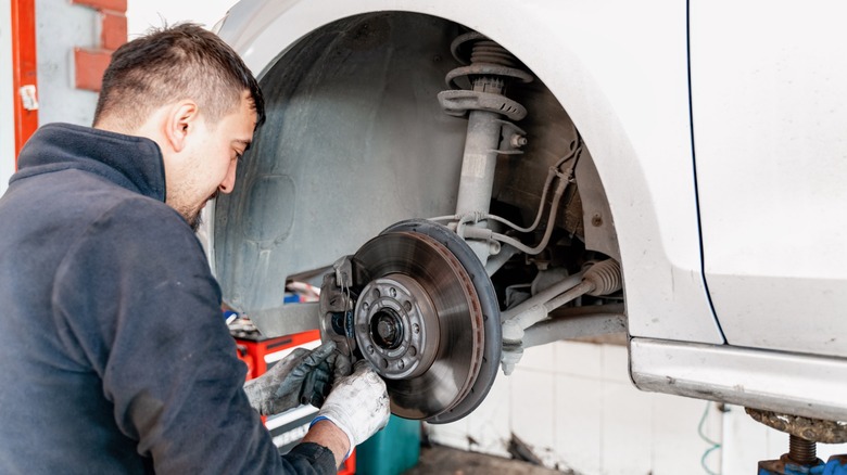 Mechanic working on brakes