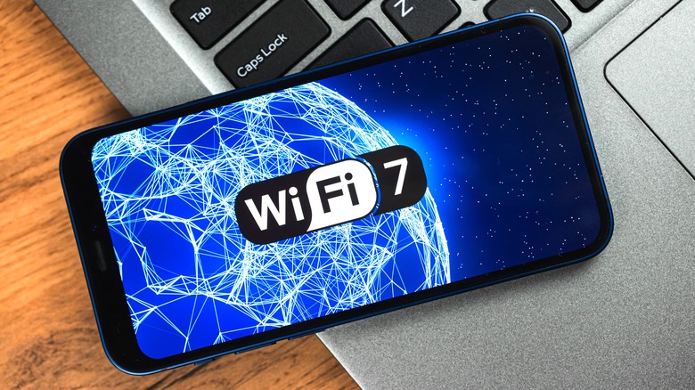 Wi-Fi 7 logo on a phone resting on laptop