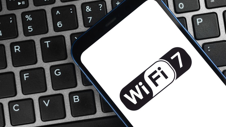 Wi-Fi 7 logo on a phone resting on laptop