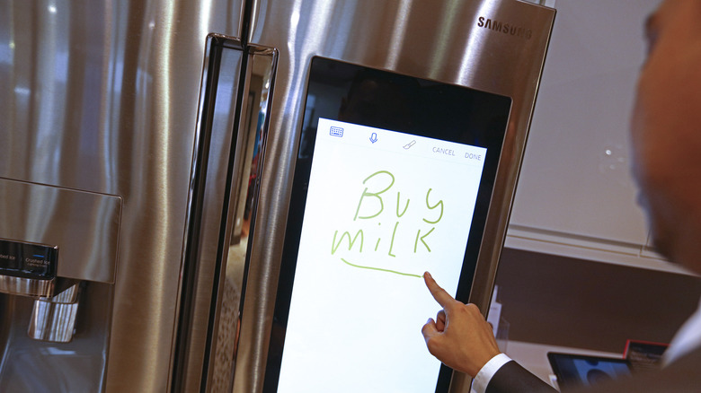 man using Samsung smart fridge