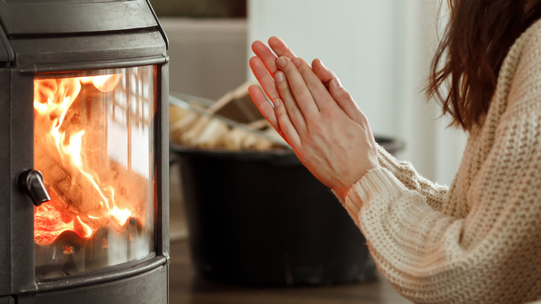 family around electric fireplace