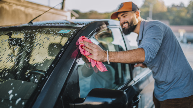 person washing car