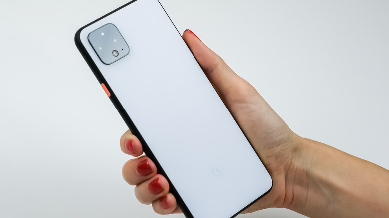 person holding a white google pixel phone