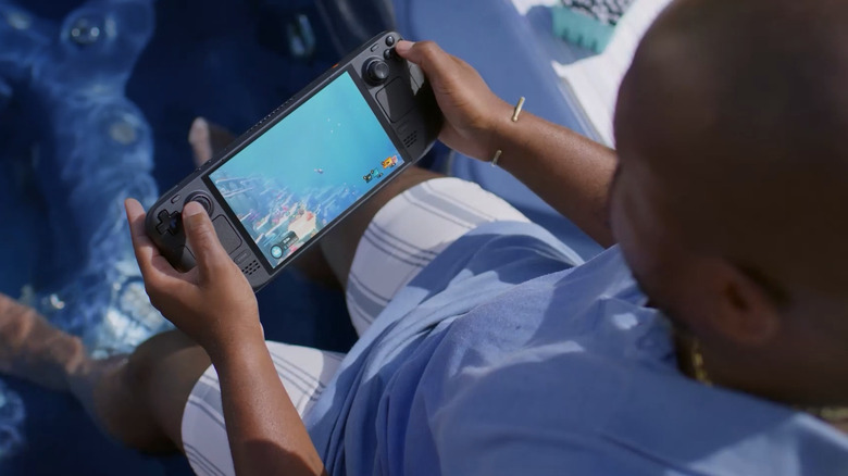 Man playing games outside on Steam Deck