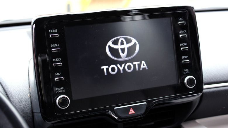 Toyota emblem displayed on a screen inside a car