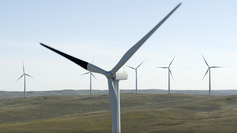 A wind turbine with a single blade painted black