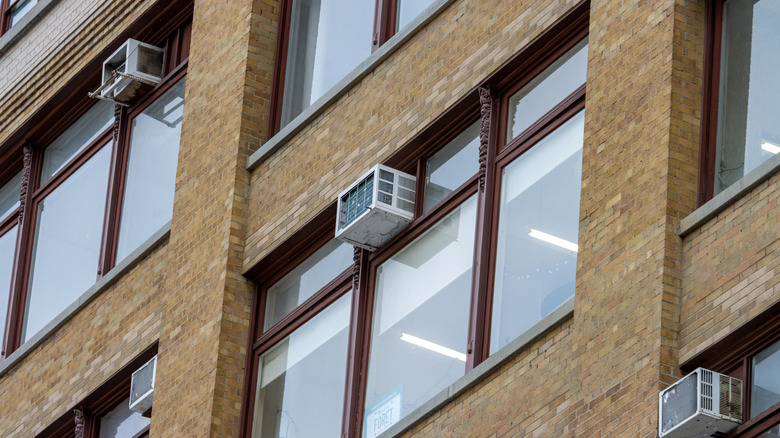 Window unit air conditioners on apartment building