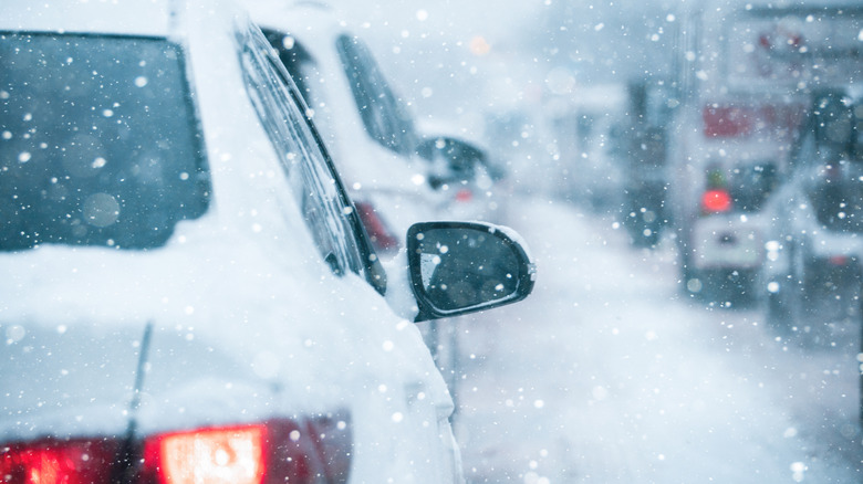 Back view of traffic in the snow.