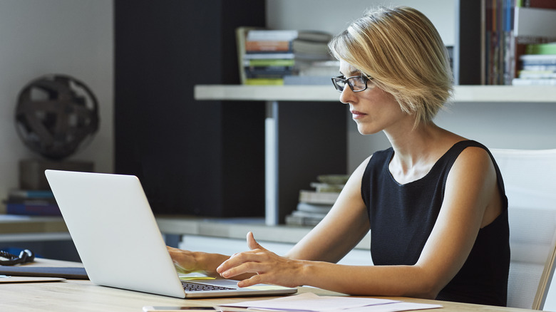 person using a laptop in an office