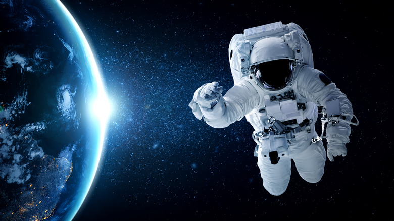 Astronaut floating near earth