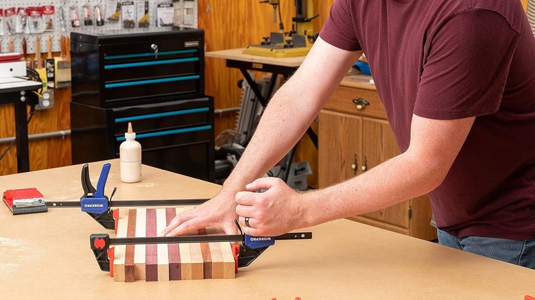 WorkPro bar clamps being used to laminate different woods together