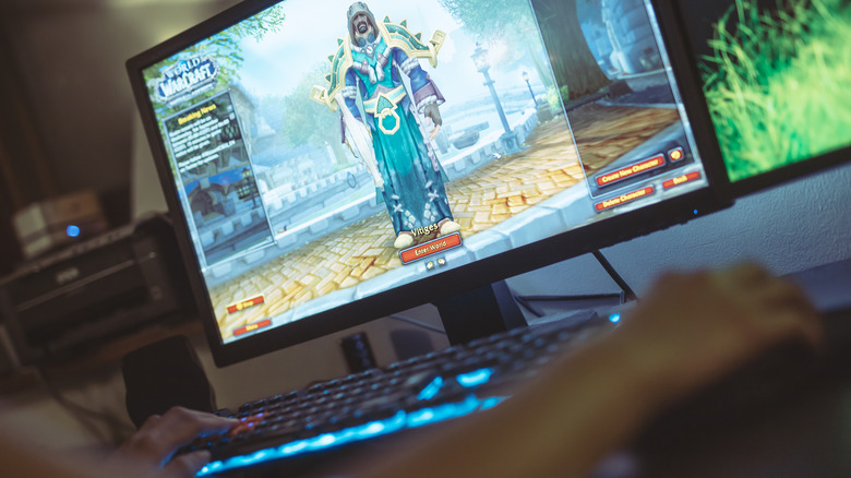 woman playing World of Warcraft on PC