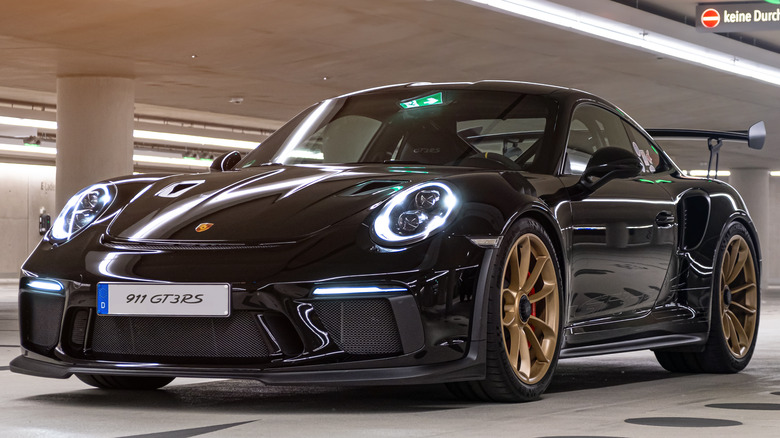 Black Porsche 911 in garage