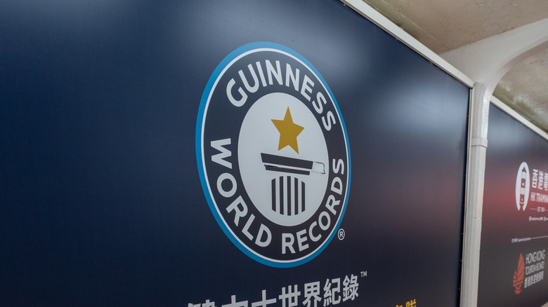 The Guinness World Records logo is seen on a wall