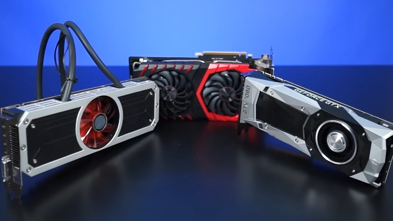 Three graphics cards on a table.