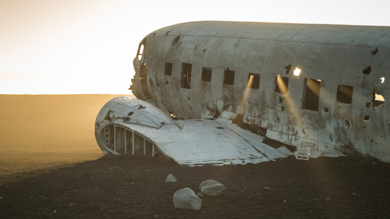 crashed airplane laying on ground