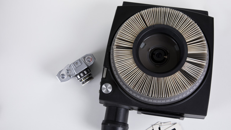 A slide projector on a plain background.