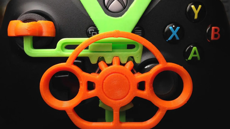 A 3D-printed mini-steering wheel attached to an Xbox controller