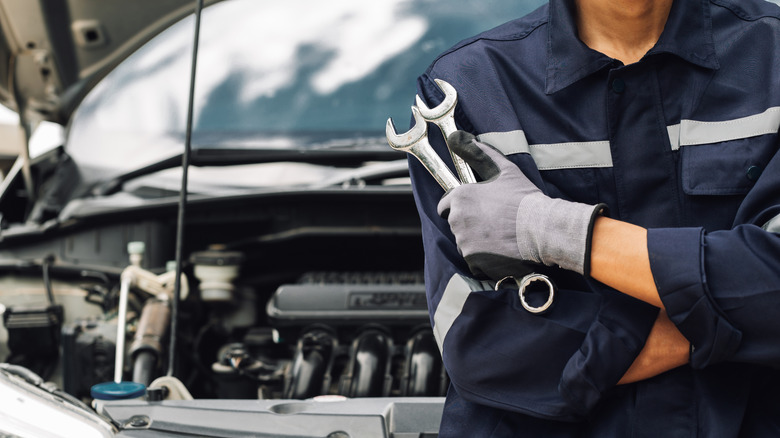 mechanic waiting to fix a car