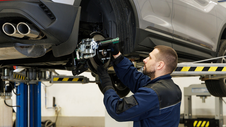 mechanic working on brakes