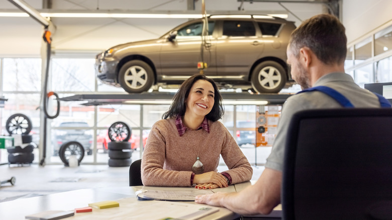 customer talking to an auto mechanic