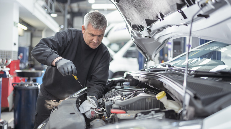 a mechanic working on a car