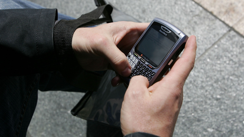 Blackberry user checking emails