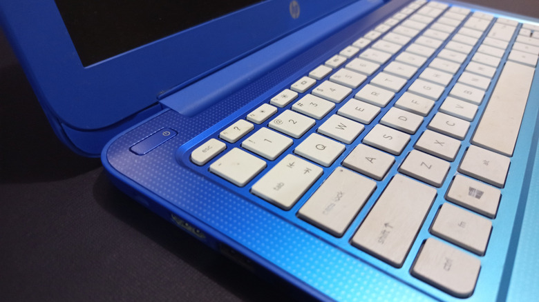 An angled view of a blue HP Chromebook and its keyboard.