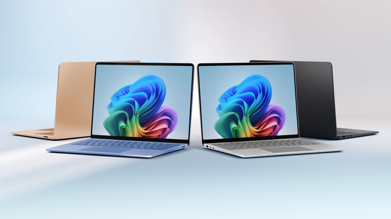Four Surface Laptops arranged in a circle
