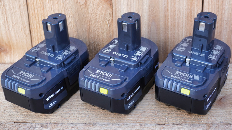 Three Ryobi 18V Lithium One+ power tool battery.