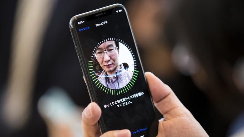 Person using Face ID on an iPhone