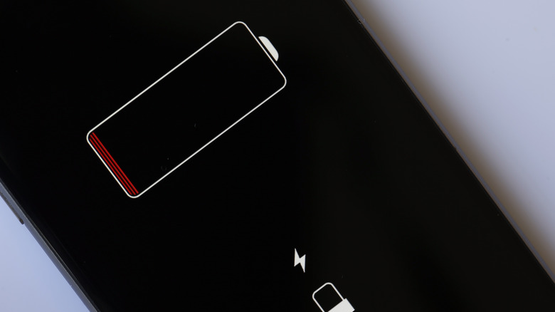 iPhone with a battery indicator on screen