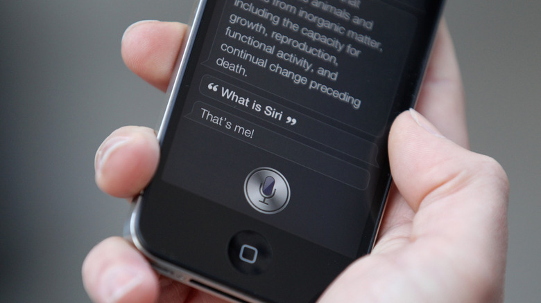 Person using Siri on an iPhone in 2010