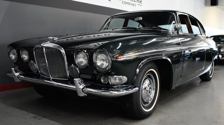 Black Jaguar 420G parked in showroom