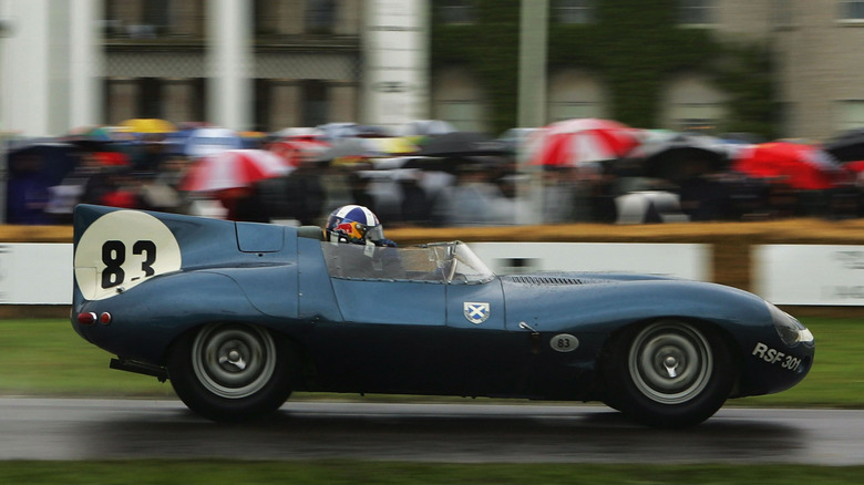Blue Jaguar D-Type on racetrack