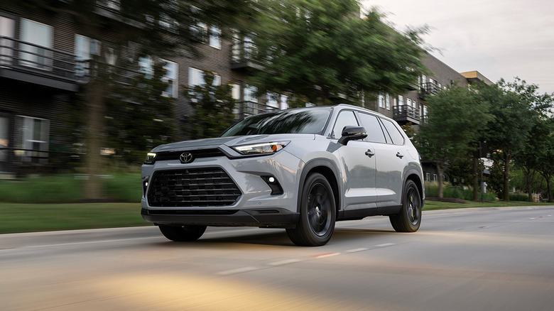 A gray 2026 Toyota Grand Highlander driving