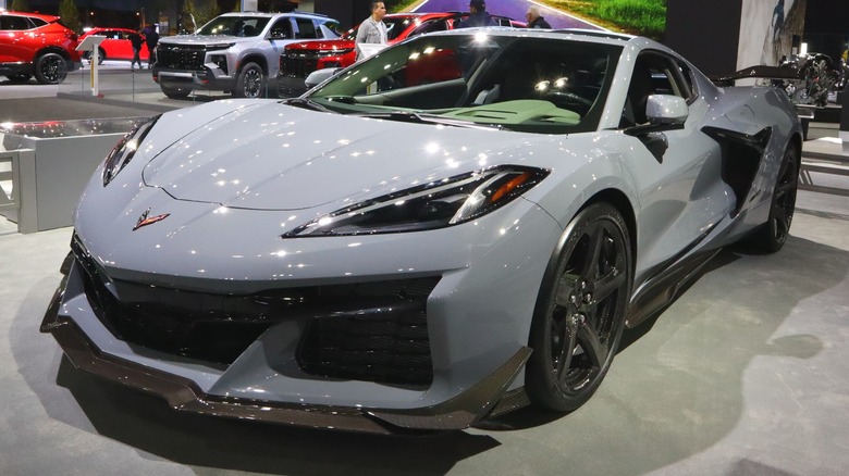 A white Chevrolet Corvette Z06 on display in Chevrolet dealership showroom.