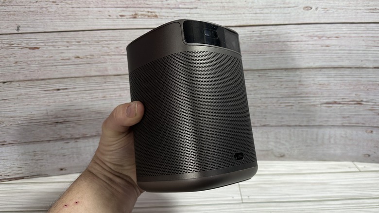 Man holding a projector