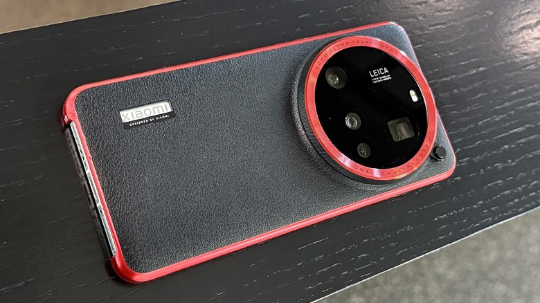 Xiaomi 15 Ultra with case on wood.