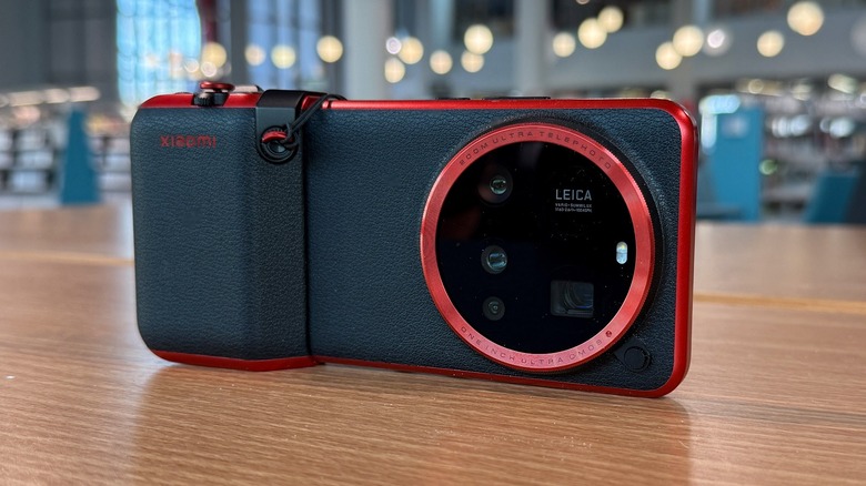 Xiaomi 15 Ultra with "Legend" camera grip on a table.