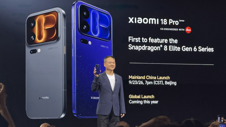 Man holding a Xiaomi 18 Pro Max on stage