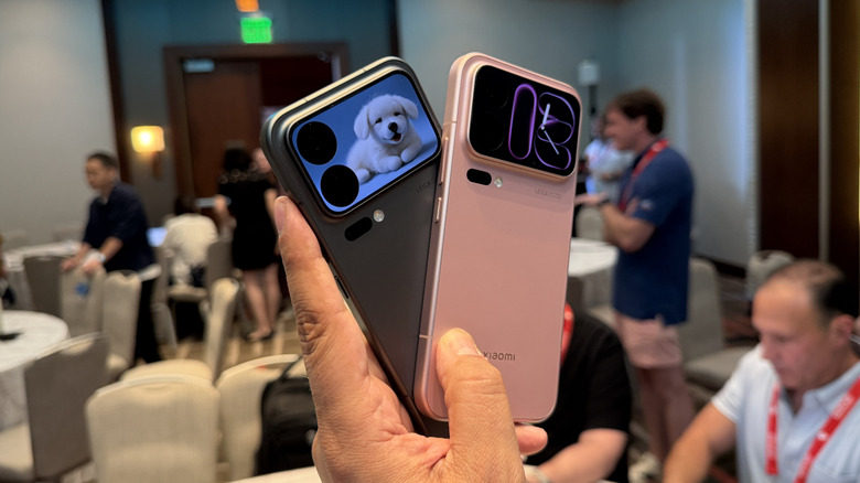 Man holding two phones.